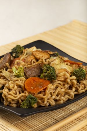 Yakisoba noodles. Yakisoba dish with meat, chicken and vegetables.