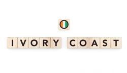 Wooden blocks bearing the name and flag of Ivory Coast. Ivorian and African Culture, national identity, travel, and geography in a copy space design.