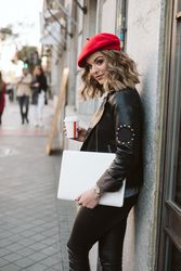 Woman with drink on the street