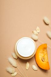 Skin care and face care concept - pumpkin cosmetic