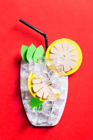 Silhouette of a glass of mojito made with cardboard with real ice