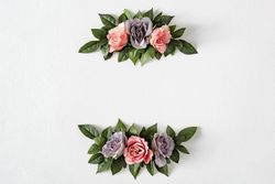 Pink and purple flowers and leaves on bright background