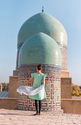 Unrecognizable tourist against oriental domes