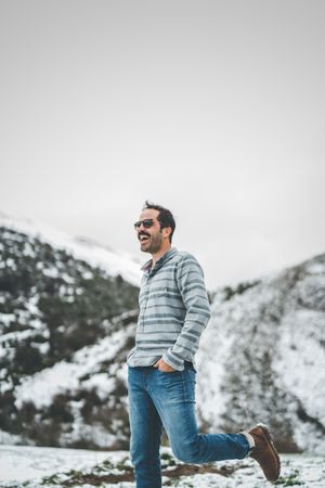 Man walking on winter field