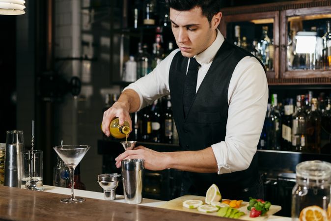 Barman working making drinks
