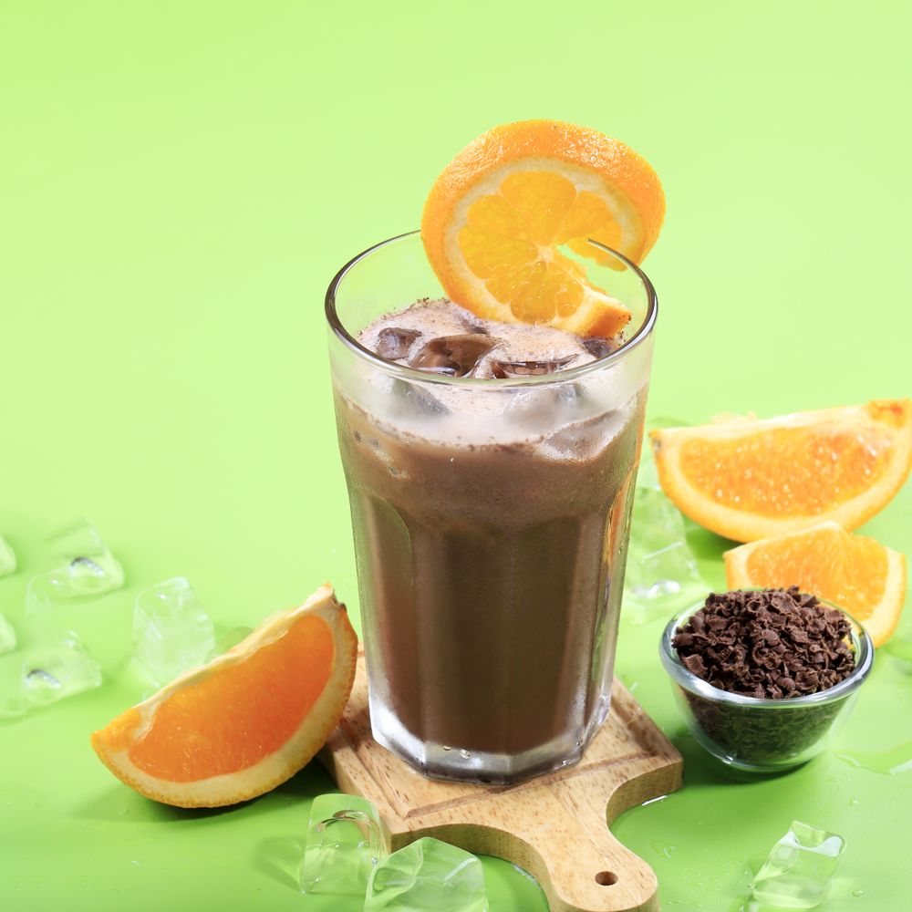 Orange Chocolate Milk on Green Table