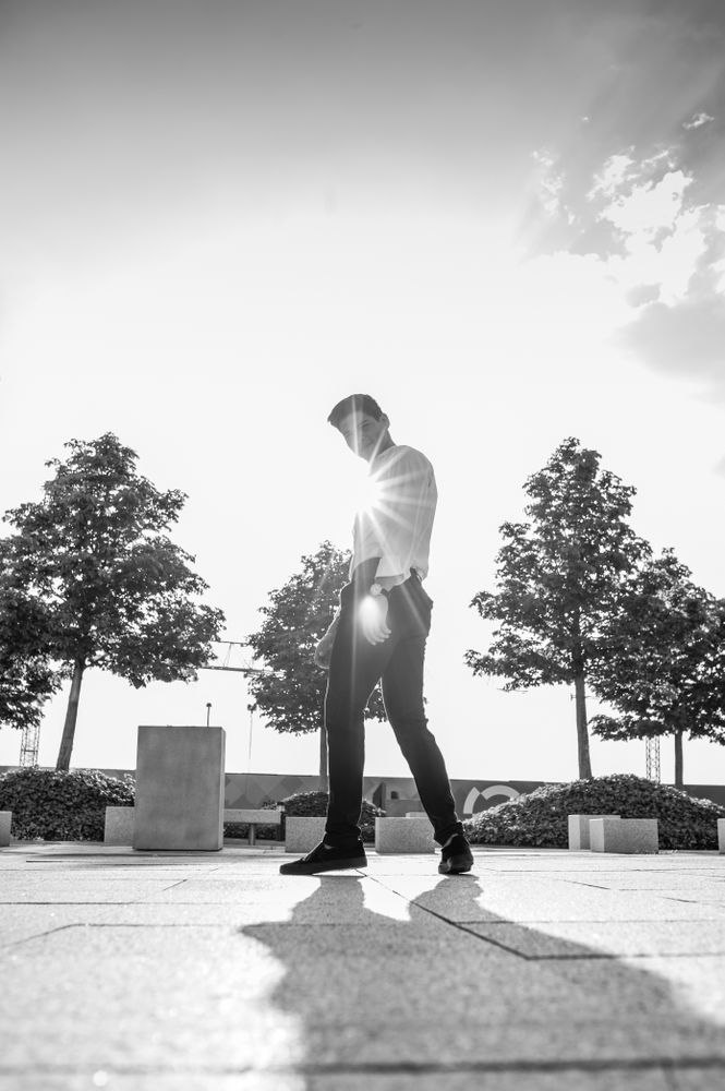 Stylish man on street in sunlight