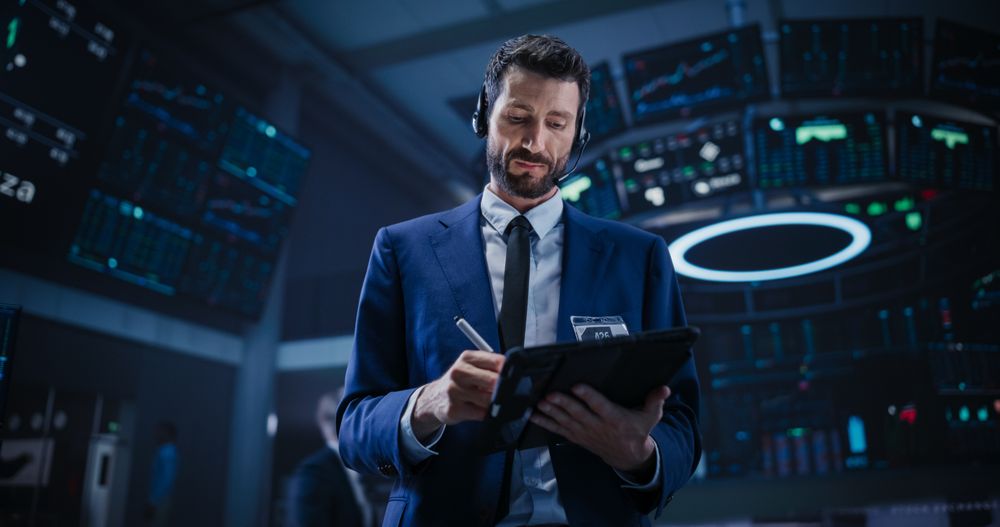 Enthusiastic Stock Exchange Agent Having a Conversation on a phone Call, Motivating a Client to Invest in a New Successful Startup That Just Went Public Through an IPO.