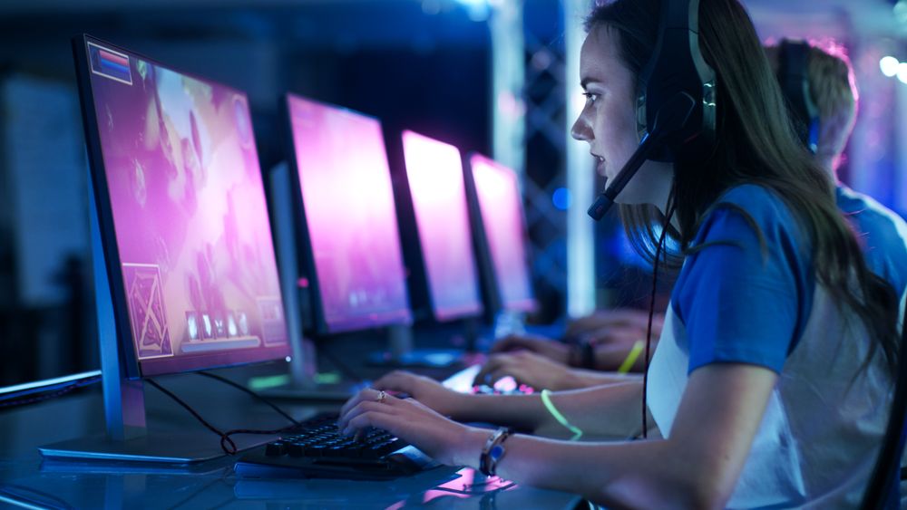 Team of Professional eSport Gamers Playing in Competitive  MMORPG/ Strategy Video Game on a Cyber Games Tournament.