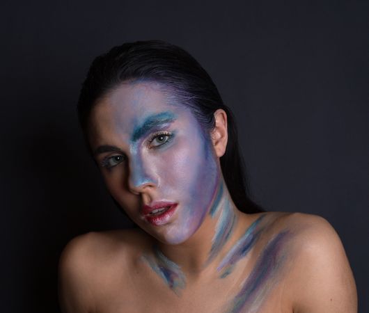 Young woman with painting face