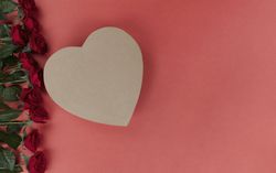 Valentine’s day celebration with red roses and heart shape gift box
