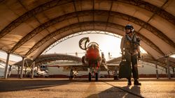 Kingsville, TX, USA - Jan 7,  2020: Lt. Madeline Swegle, in airplane hanger with fighter jet