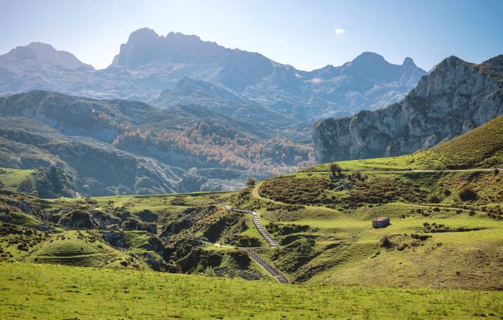 Landscape with path between mountains