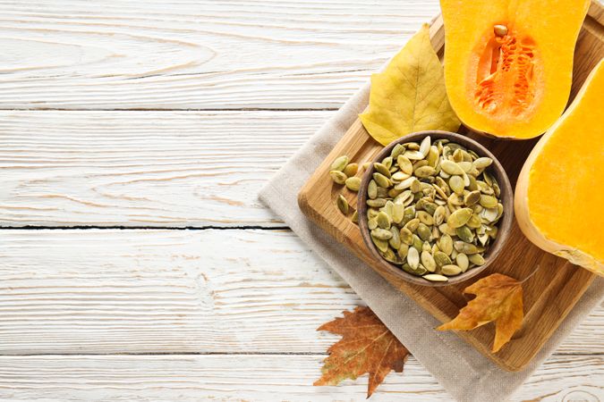 Cooking ingredients for fall season - pumpkin seeds, pumpkin