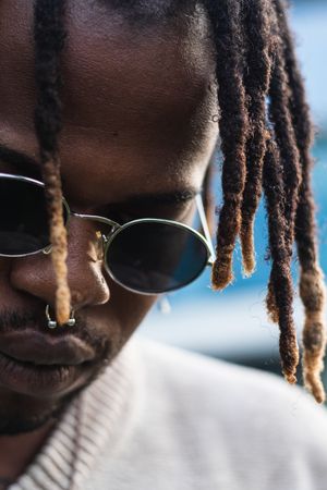 Cool Black guy with dreadlocks in city center
