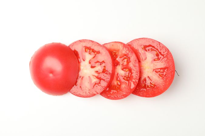 Slices of tasty tomato isolated on neutral background
