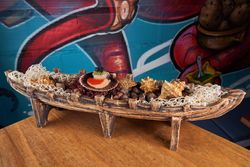 Boat with scallops in restaurant