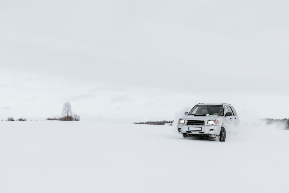 Car driving on snow field