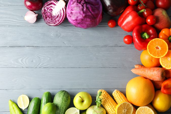 Different vegetables and fruits on wooden background, copy space