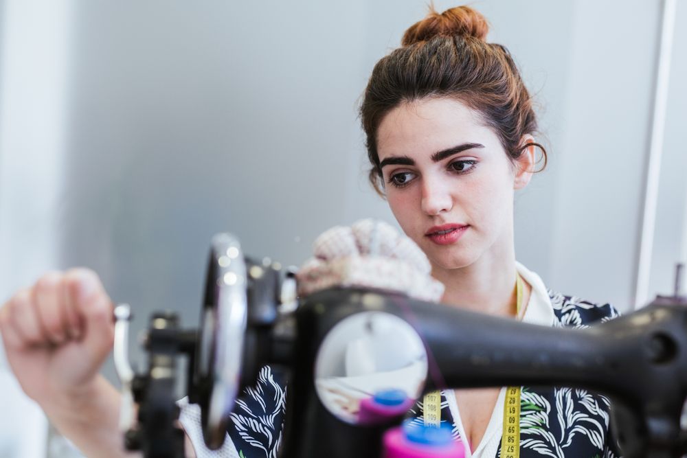 Woman in a sewing school