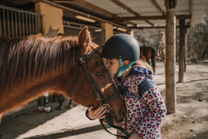 Girl kissing a horse