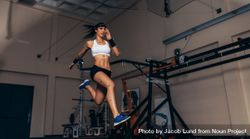 Female athlete with motion capture sensors on her body running in biomechanics lab 48GjZ5
