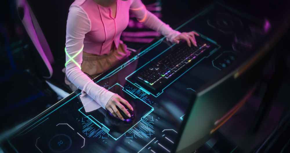 Close Up of a Young Female Playing Online Video Games on a Desktop Computer.