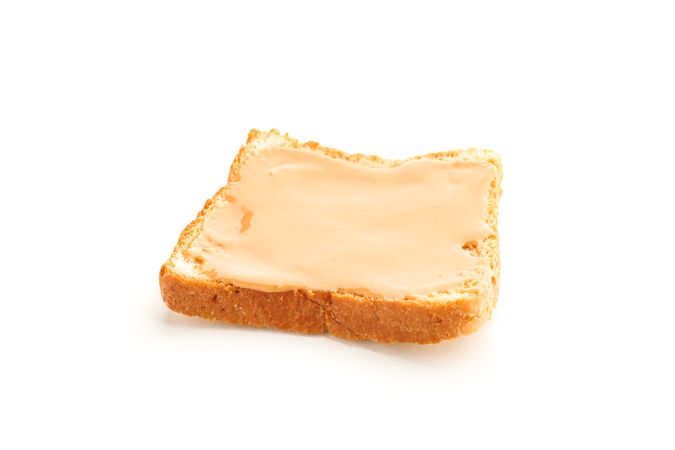 Peanut butter sandwich isolated on light background. A traditional product of American cuisine