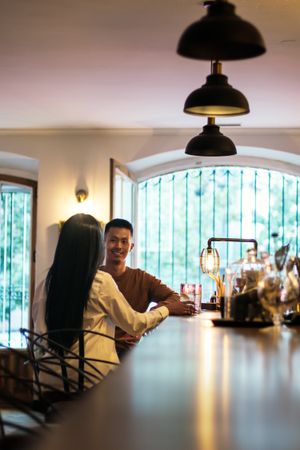 Asian man and a Black Latina woman on a date