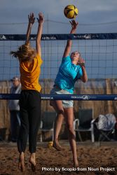 Two girls playing volleyball 4dkGa5