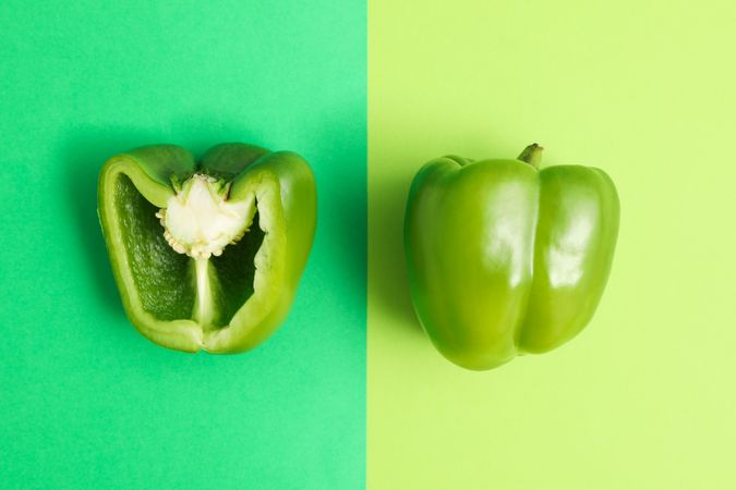 Fresh pepper on green background, space for text