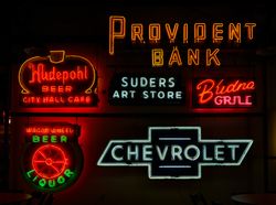 An array of signs for banks, cars, restaurants, at the American Sign Museum, Cincinnati, Ohio v5qR14