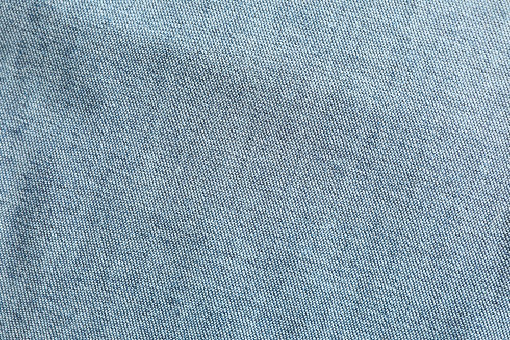 Texture of blue jeans as background, space for text