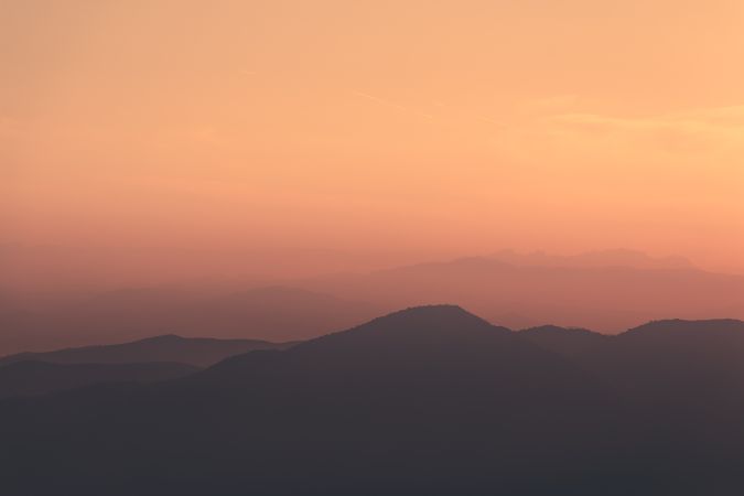 Sunset sky over mountain ridge