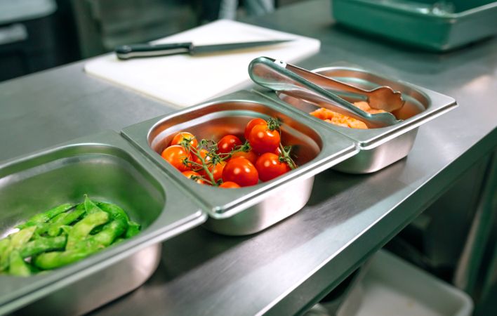 Close up of ingredients for cooking being prepared in restaurant kitchen