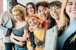 Diverse teen students taking selfie together