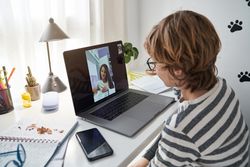 Boy making video call with classmate