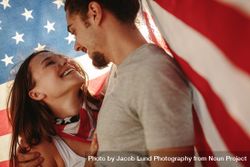Affectionate couple under USA flag 5onnG0