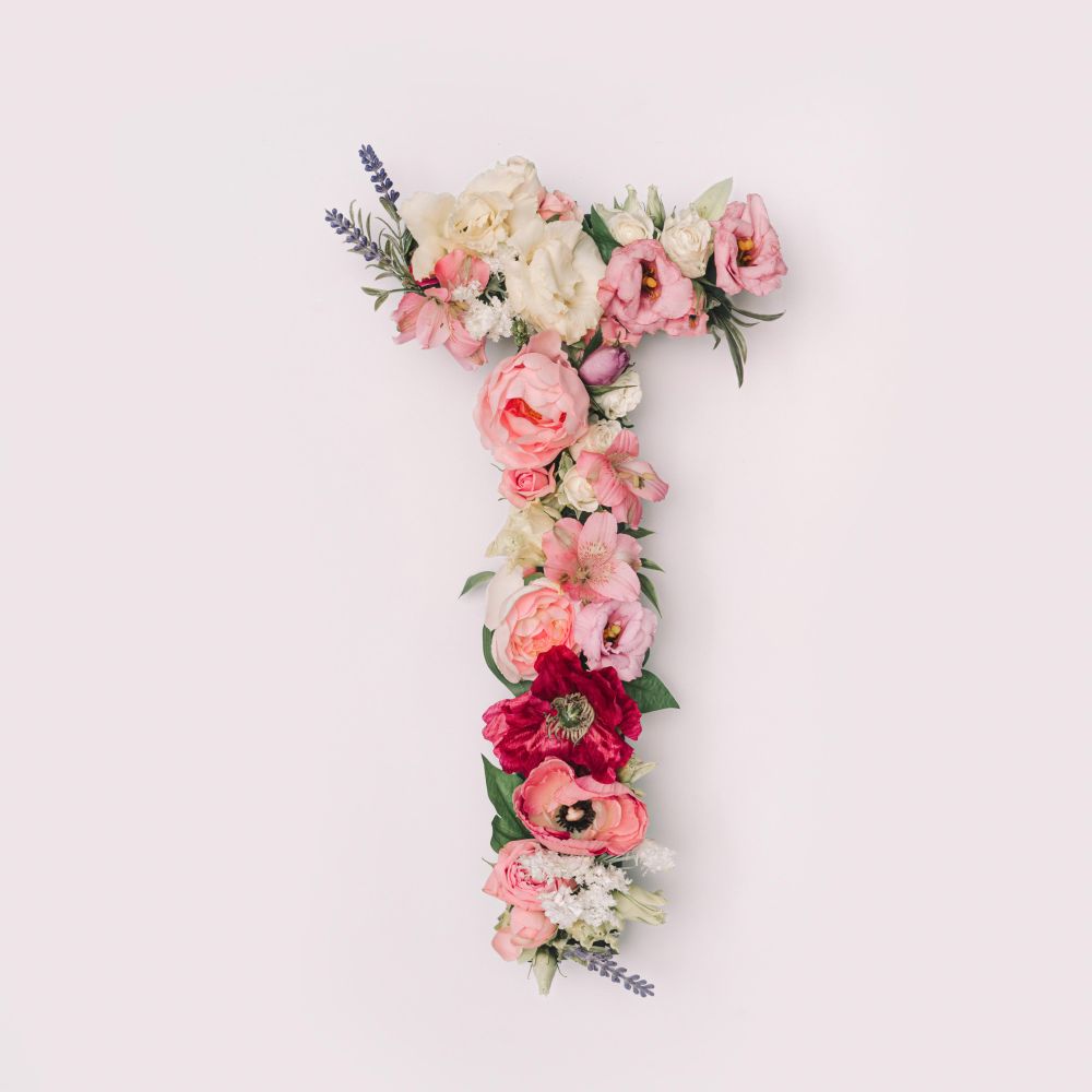 Letter T made of real natural flowers and leaves