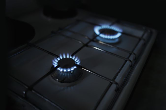 Two blue flames on gas range