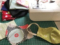 Multicolored fabric with cut out face mask pattern for sewing