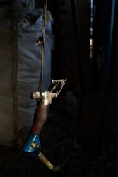 Sheep shearing machine hanging on rope