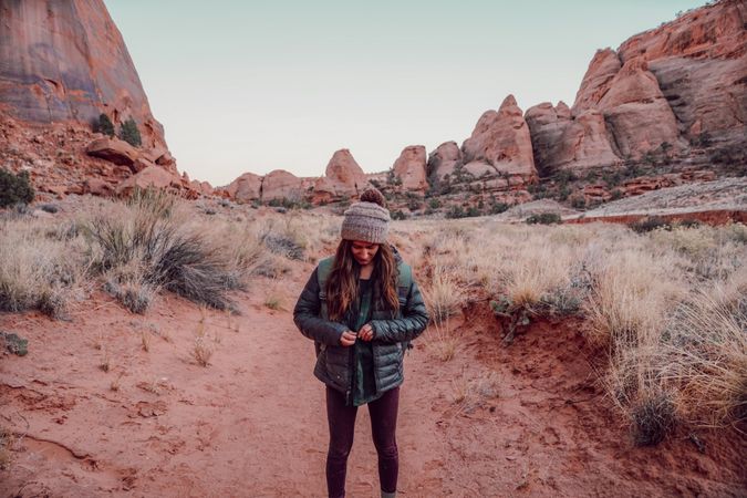 Woman standing in desert landscape