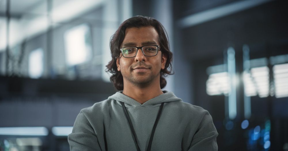 Portrait of a Talented Indian Man Looking at Camera and Lightly Smiling.