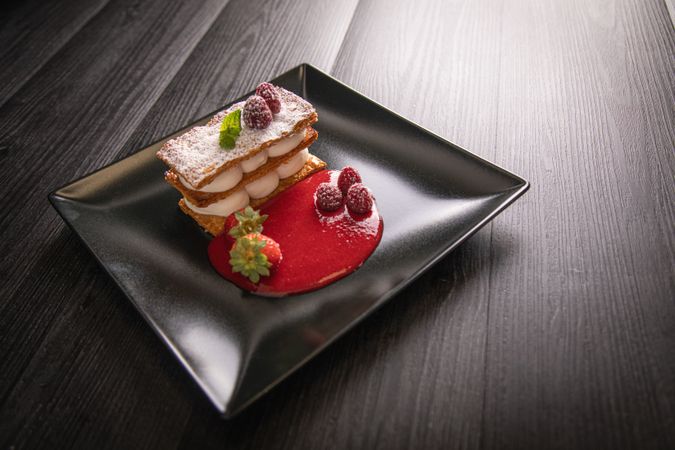 Diphlomate cream and red fruit strudel in elegant plate