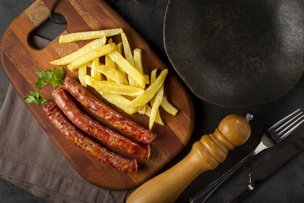 Grilled German sausage with french fries.