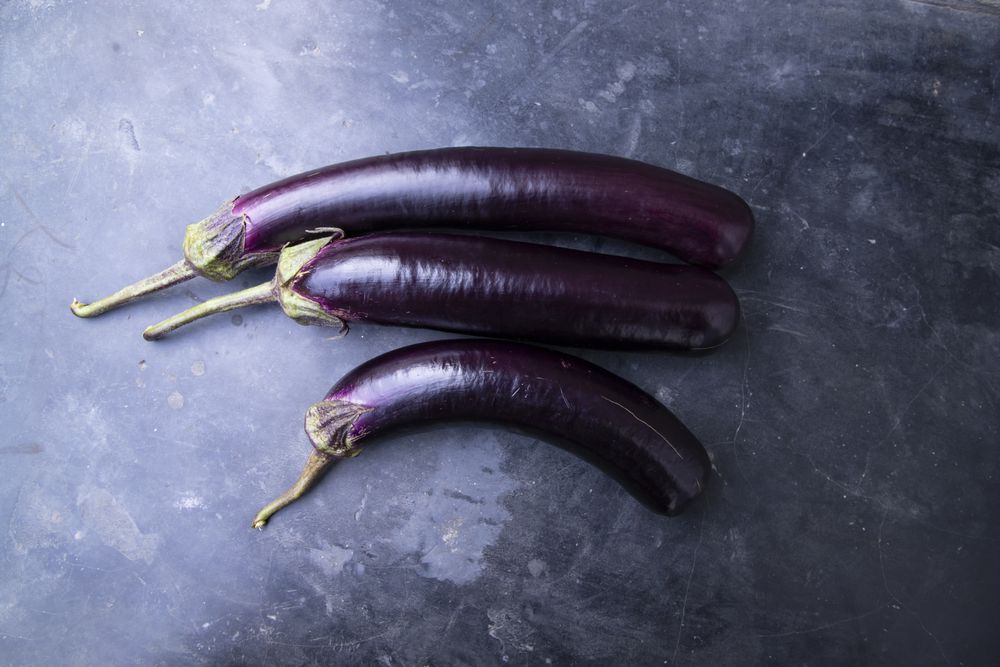 Fresh eggplant on a concrete Floor
