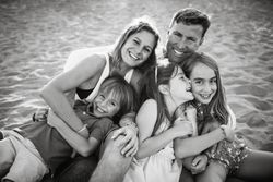Beautiful happy family with children on beach
