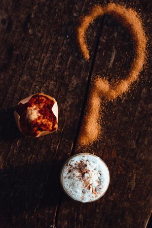 Cupcake near question mark and coffee