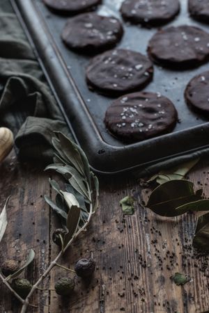 Olive twig near chocolate biscuits